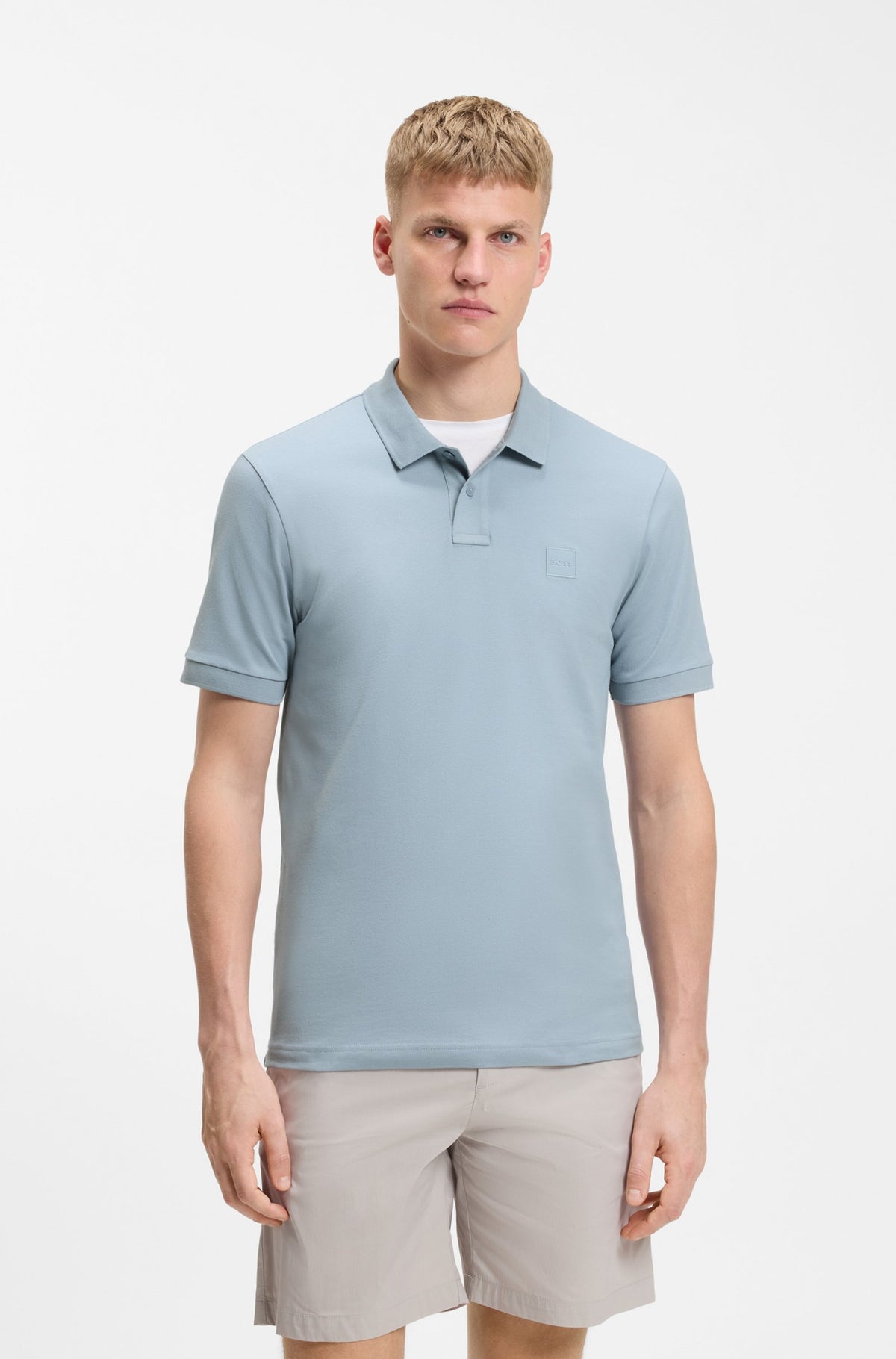Polo de ajuste slim em algodão elástico com emblema com logótipo